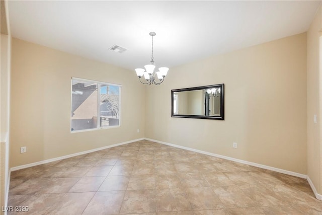 empty room with a notable chandelier