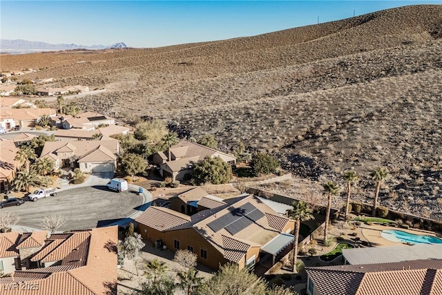 birds eye view of property with a mountain view