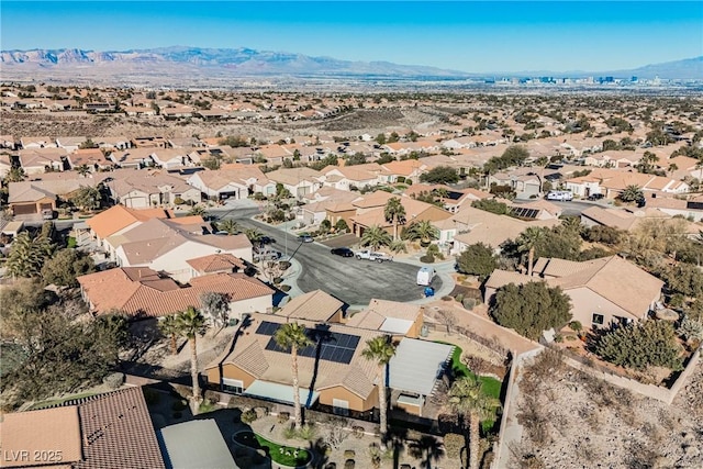 birds eye view of property featuring a mountain view