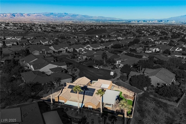 birds eye view of property with a mountain view