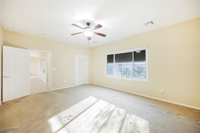 carpeted empty room with ceiling fan