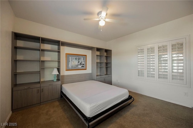 bedroom featuring dark colored carpet and ceiling fan