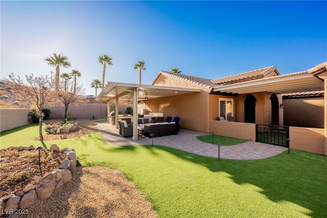 back of house featuring an outdoor hangout area, a patio, and ceiling fan