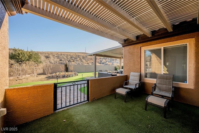 view of patio / terrace with an outdoor living space and a pergola