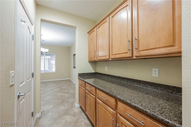 kitchen featuring dark stone counters