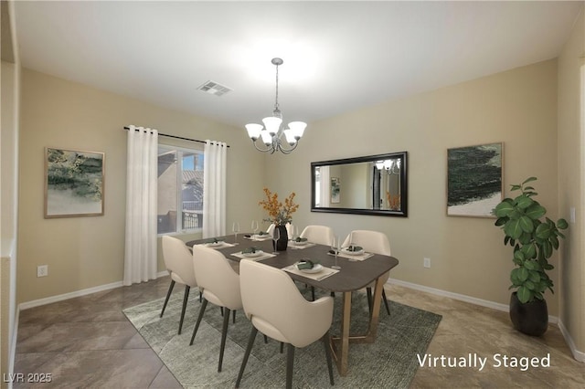 dining area featuring tile patterned floors and an inviting chandelier