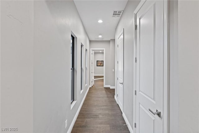 hallway featuring dark hardwood / wood-style floors