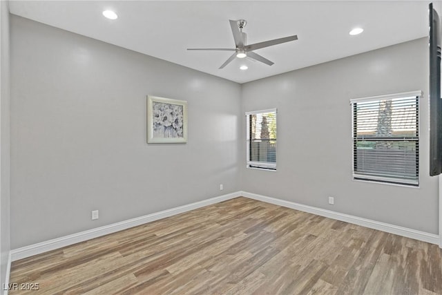 empty room featuring light wood-type flooring and ceiling fan