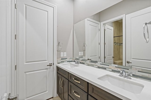 bathroom featuring vanity and backsplash