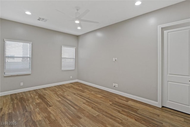 spare room featuring ceiling fan and wood-type flooring