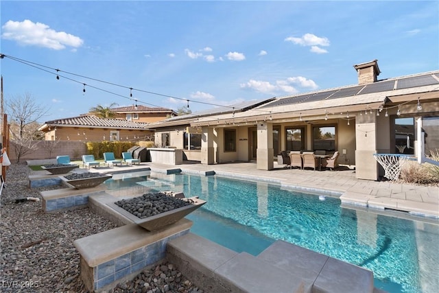 view of swimming pool featuring a patio