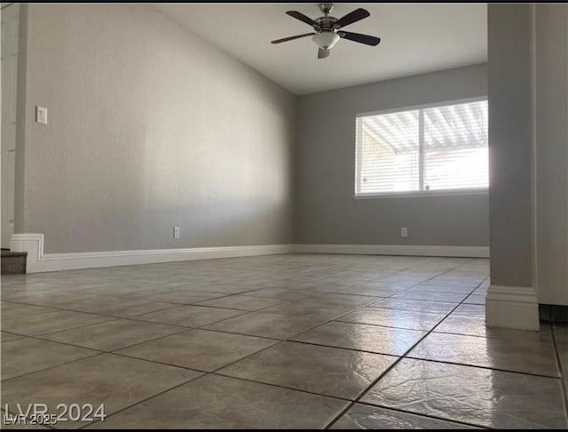 unfurnished room with ceiling fan and lofted ceiling