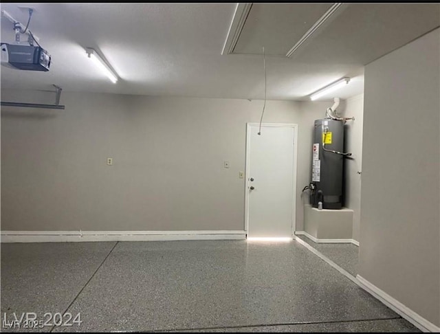 garage featuring gas water heater and a garage door opener