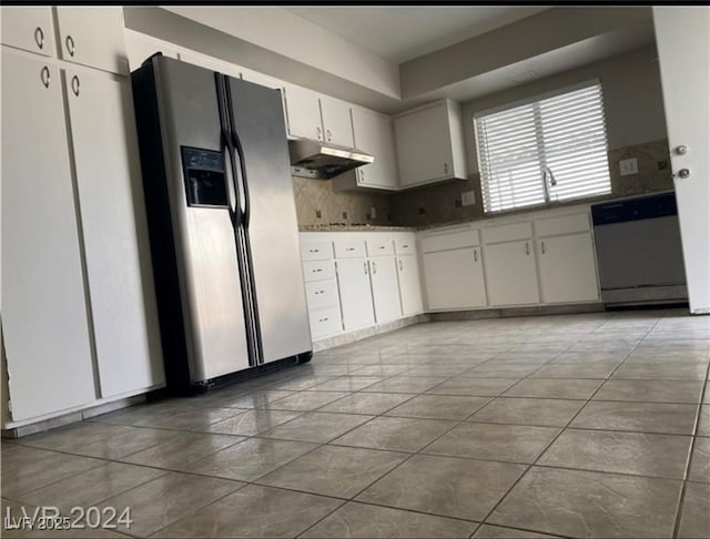 kitchen featuring tasteful backsplash, tile patterned floors, sink, white cabinetry, and stainless steel appliances