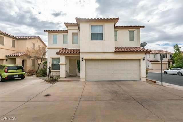 mediterranean / spanish-style house featuring a garage