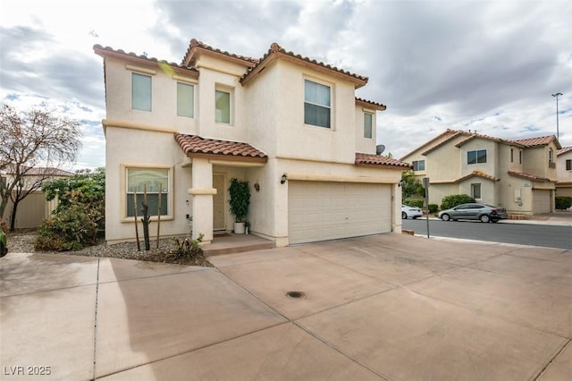 mediterranean / spanish house featuring a garage