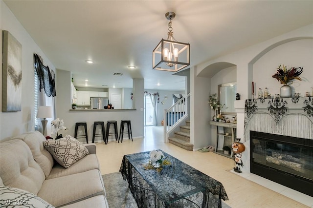 living room with an inviting chandelier