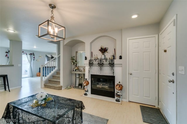 living room with a chandelier and hardwood / wood-style flooring