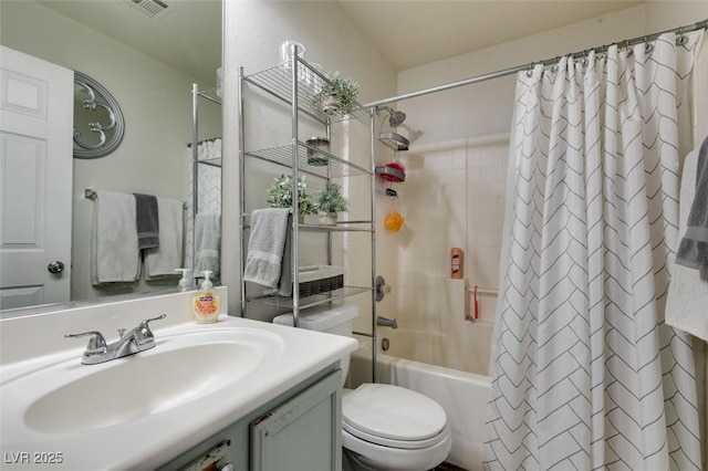 full bathroom with toilet, vanity, and shower / tub combo with curtain