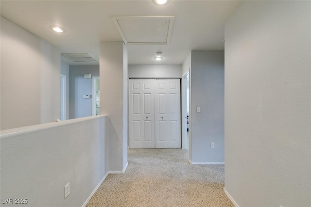 corridor with light colored carpet