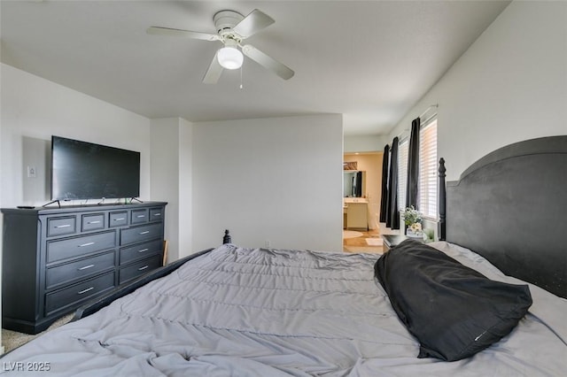 bedroom with ceiling fan and connected bathroom