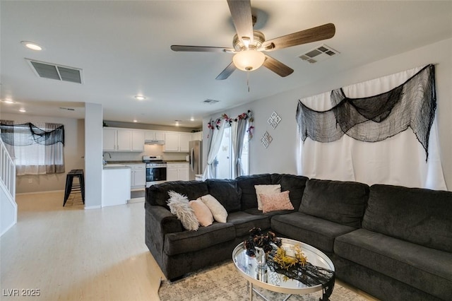 living room with ceiling fan