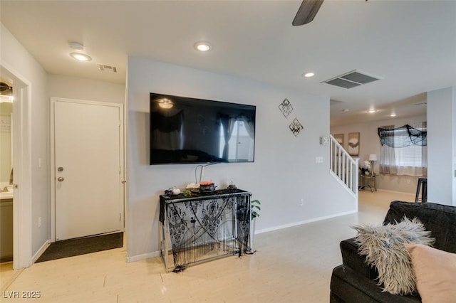 living room featuring ceiling fan