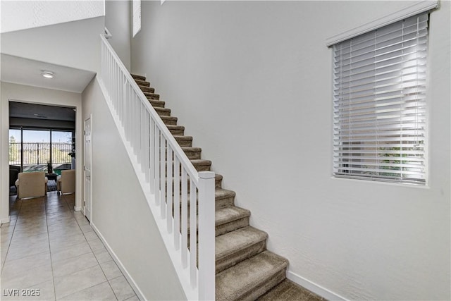 stairs with tile patterned flooring