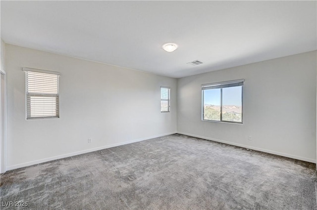 empty room featuring carpet flooring