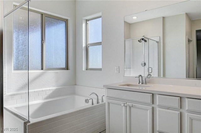 bathroom featuring independent shower and bath and vanity