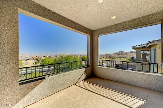 balcony featuring a mountain view