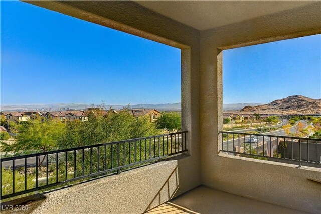 balcony featuring a mountain view