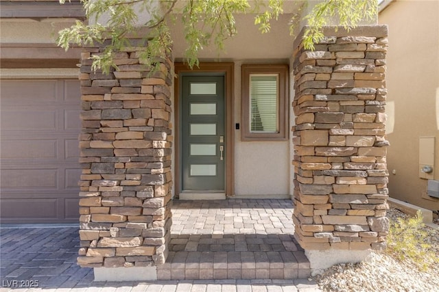 entrance to property featuring a garage