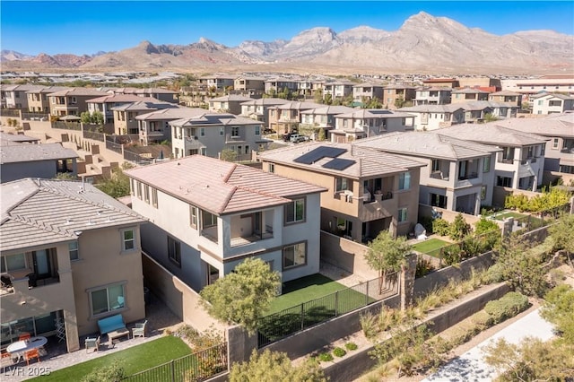 birds eye view of property featuring a mountain view