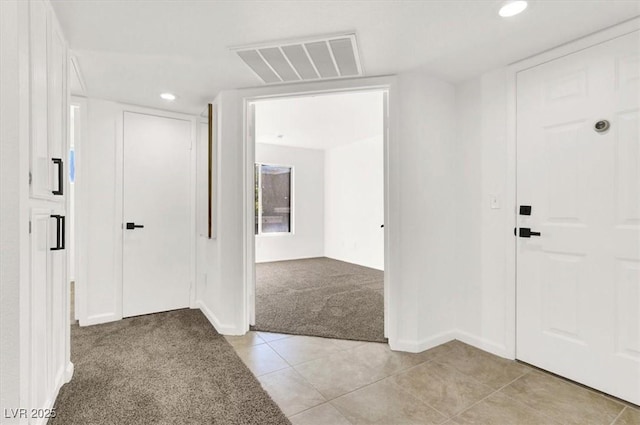 view of carpeted foyer