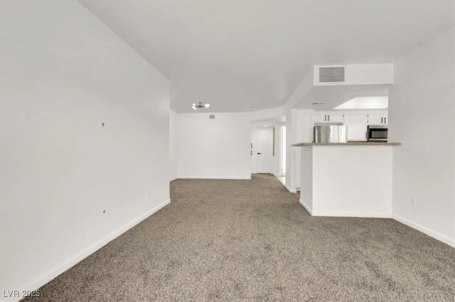 unfurnished living room with carpet flooring