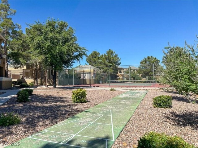 view of property's community with tennis court