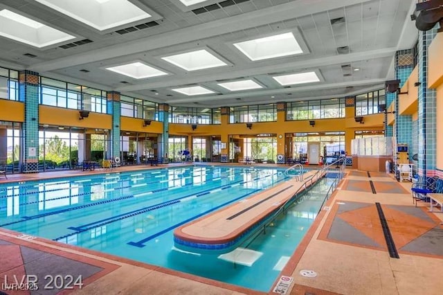 view of pool featuring a skylight