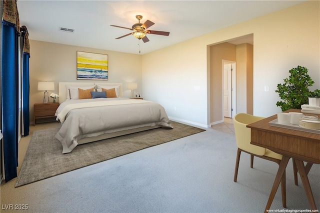 bedroom with ceiling fan and light colored carpet