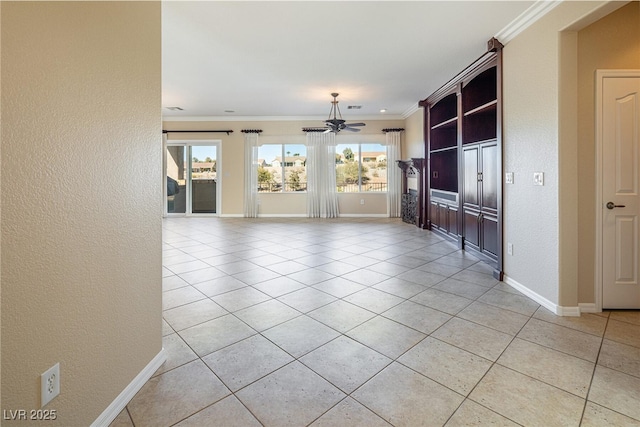 unfurnished living room with ceiling fan, crown molding, and light tile patterned flooring