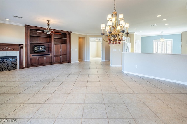 unfurnished living room featuring light tile patterned floors, ornamental molding, ceiling fan with notable chandelier, and a tiled fireplace