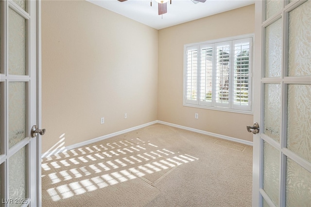 spare room with french doors and carpet flooring