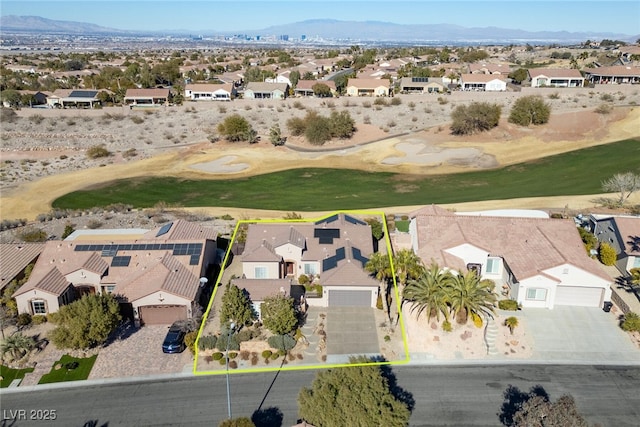 birds eye view of property with a mountain view