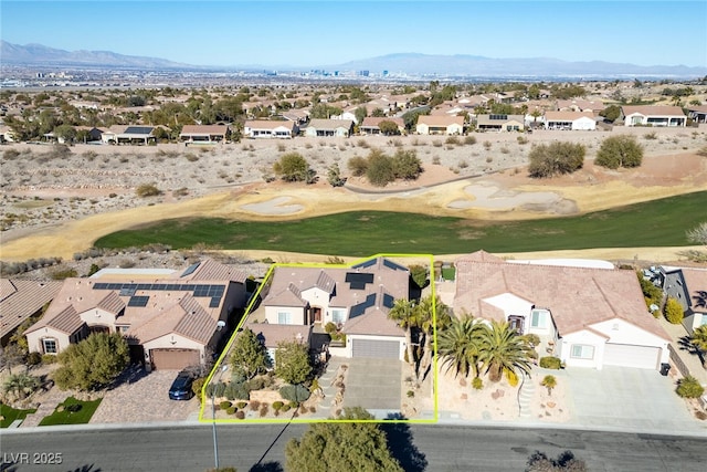 birds eye view of property featuring a mountain view