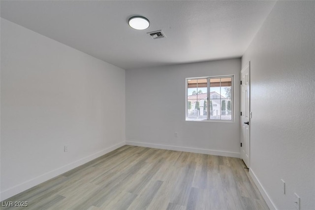 unfurnished room featuring light hardwood / wood-style flooring