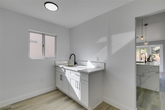 bathroom with vanity and hardwood / wood-style flooring