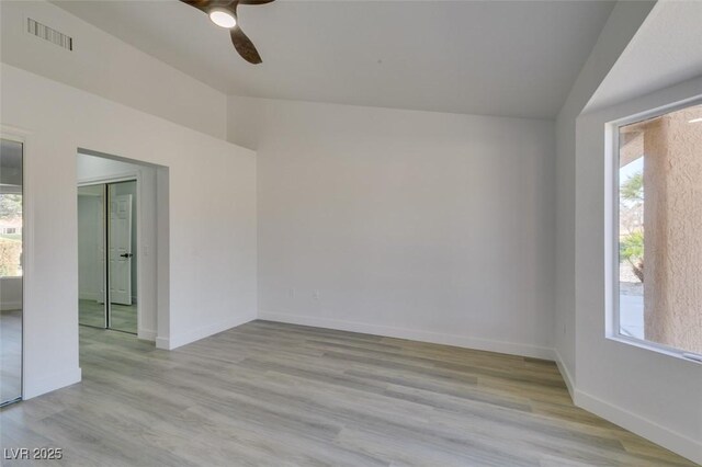 spare room featuring ceiling fan and light wood-type flooring