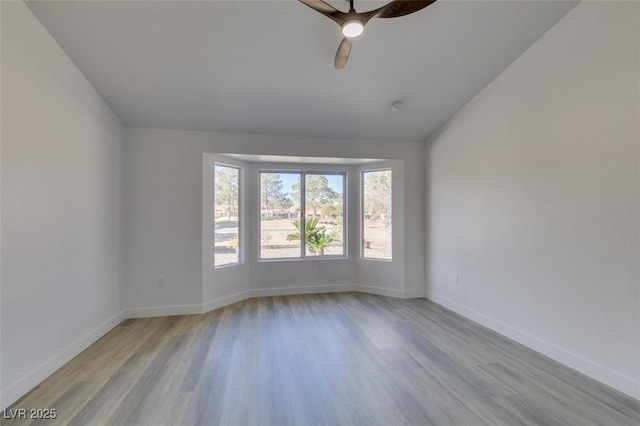 unfurnished room with ceiling fan and light hardwood / wood-style floors