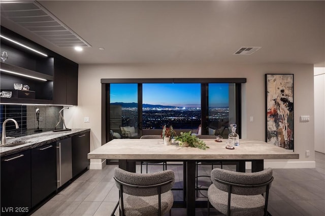 dining area featuring wet bar