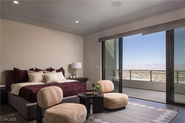 bedroom with tile patterned flooring and access to outside